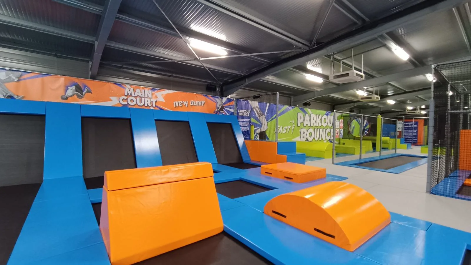 Trampoline courts and foam blocks in a New Jump park